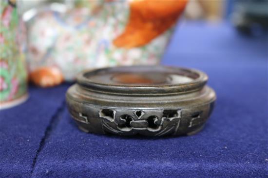 A Japanese Kutani porcelain lion dog candlestick, enamelled and gilt decoration and a Canton vase candlestick height 10cm
